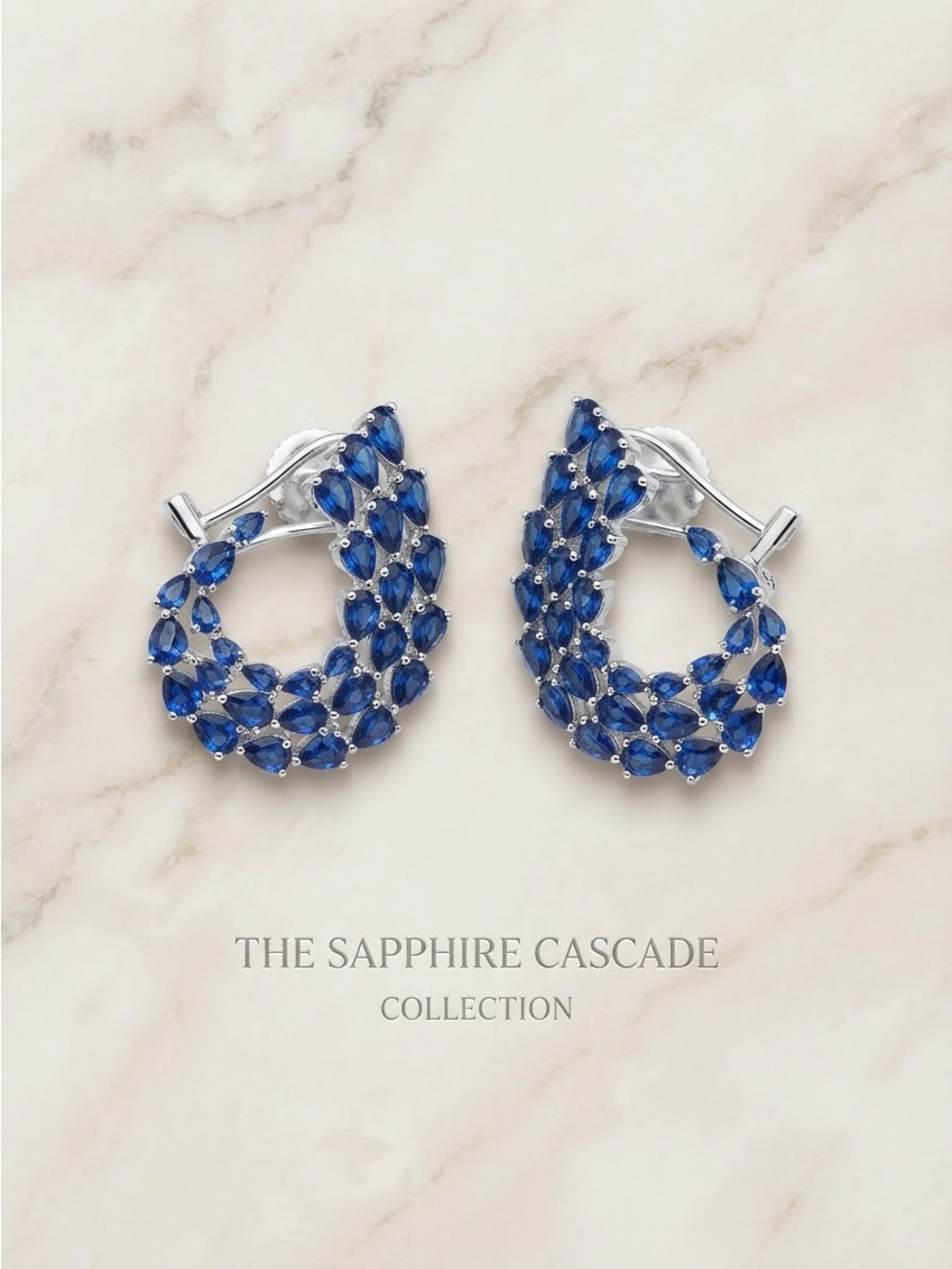 Sapphire earrings with double lock.